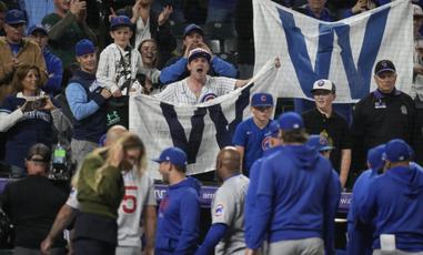 Chicago Cubs fans Fly the W as long as they can